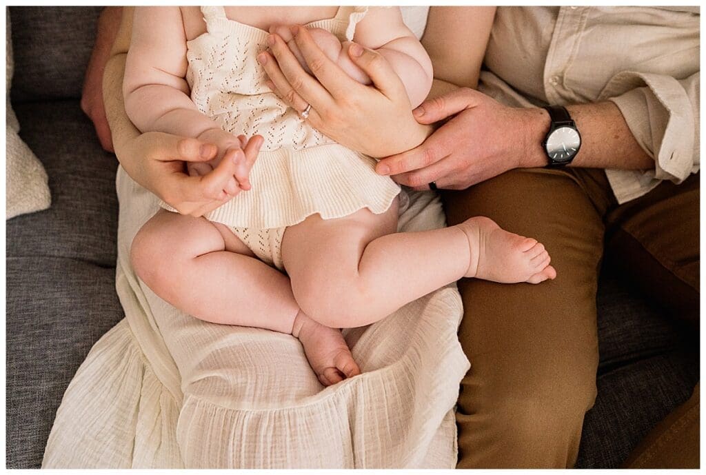 In home family session Winnipeg with parents and baby girl