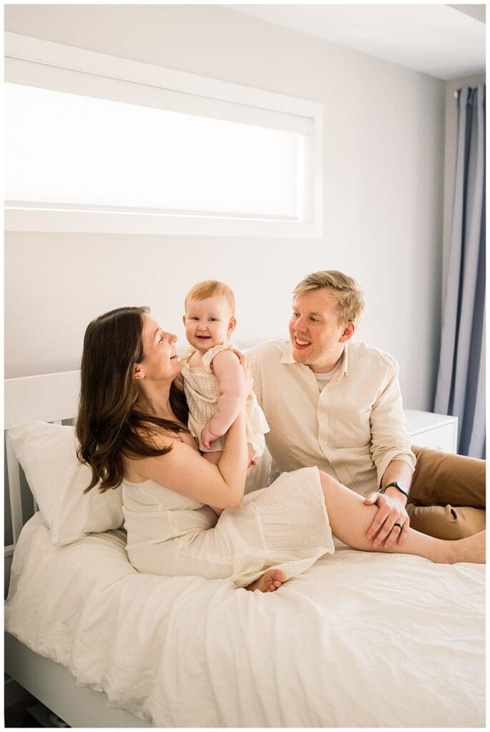 In home family session Winnipeg with parents and baby girl